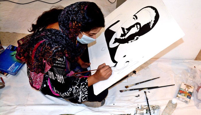 A student gives final touch to the portrait of Allama Muhammad Iqbal on his 147th Birth Anniversary organised by Knowledge Academy of Arts. — APP