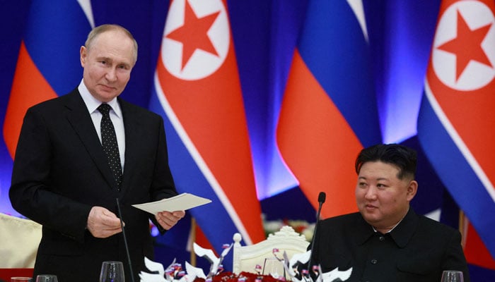 Russias President Vladimir Putin (left) and North Koreas leader Kim Jong Un attend a state reception in Pyongyang, North Korea on  June 19, 2024. — Reuters