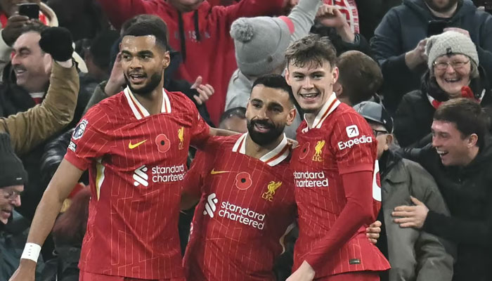 Liverpools Egyptian striker Mohamed Salah (centre) celebrates with teammates after scoring their second goal during the English Premier League football match between Liverpool and Aston Villa at Anfield in Liverpool, north west England on November 9, 2024. — AFP