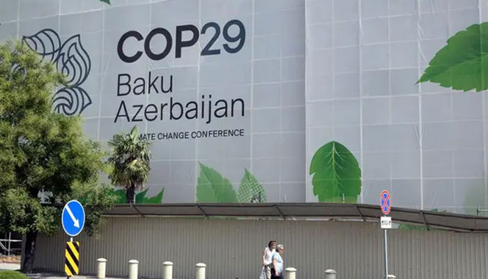 Branding for the COP29 climate conference covers the facade of a building under renovation in the Azerbaijani capital of Baku on September 11, 2024.— AFP