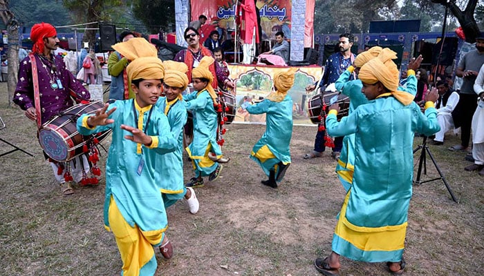 Young artists perform a traditional Punjabi dance on the beat of drums and promoting the rich culture of Punjab at the opening ceremony of the Annual Ten-Day Folk Festival Lok Mela at Lok Virsa in the federal capital. — APP/File