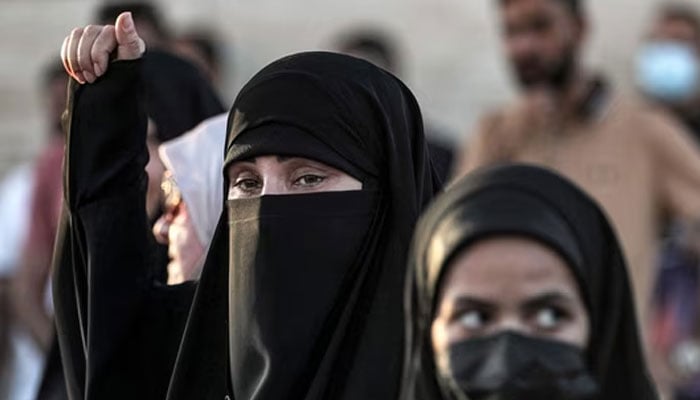 Women attend a demonstration in support of a proposed parliamentary amendment to the Personal Status Law in Baghdad. — AFP/File