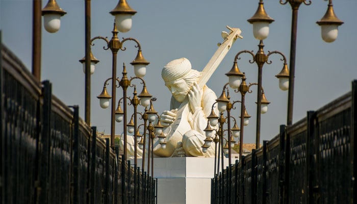 Statue of sufi poet and philosopher Shah Abdul Latif Bhittai, sculpted by Nadir Ali Jamali, situated at the centre of the Karar Lake in Bhit Shah.— Instagram@EmmanuelGuddu/file