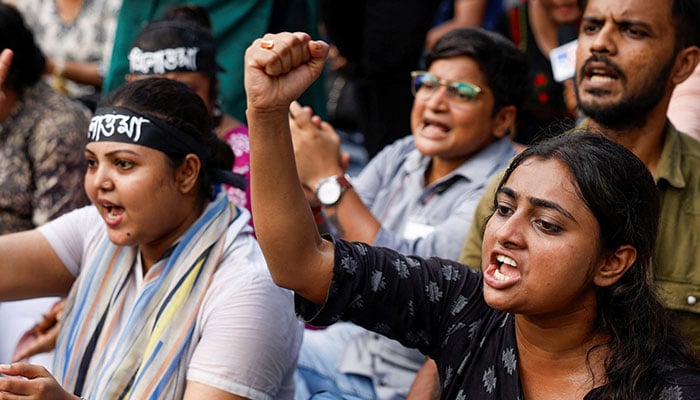 Medics sit and chant slogans as they attend a protest condemning the rape and murder of a trainee medic at a government-run hospital, in Kolkata, India on September 10, 2024.— Reuters