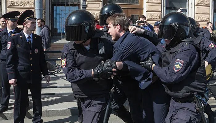 Russian [olice detain a protester during a May Day rally in Saint Petersburg on May 1, 2019. — AFP