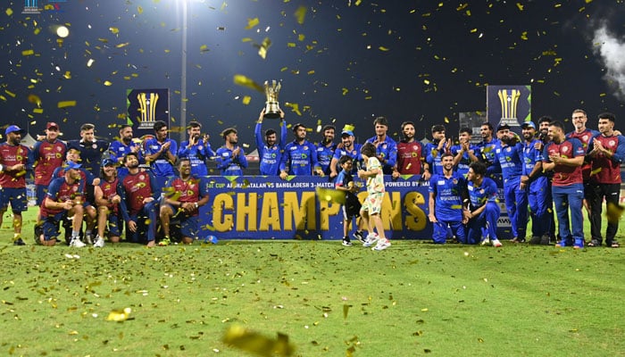 Afghan cricket players celebrating in photo session holding the trophy. — X@ACBofficials/file