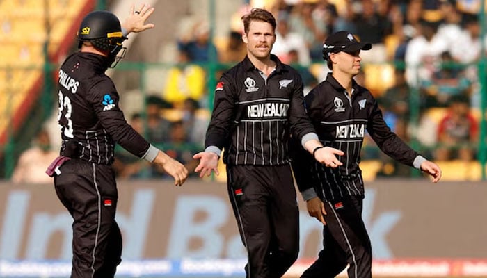 New Zealands Lockie Ferguson (centre) celebrates with teammates after taking the wicket of Sri Lankas Chamika Karunaratne on November 9, 2023. — Reuters