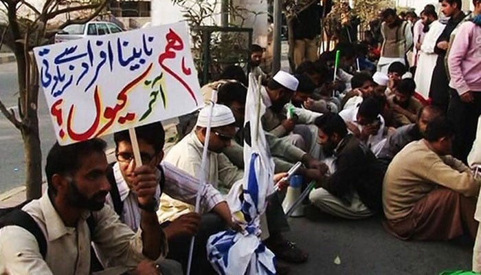 A representational image of visually impaired persons protesting.— APP/file