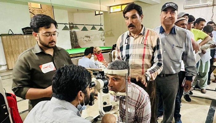 A representational image shows a doctor examining the eyes of patients on May 19, 2024. — Facebook@AlEhsanWelfareEyeHospital