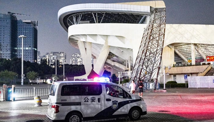 A police car is seen at the Zhuhai Sports Centre on November 12, 2024, a day after a car rammed through the site killing. — AFP