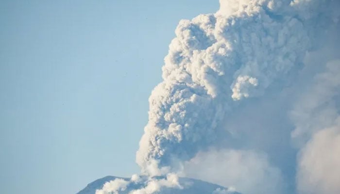 Mount Lewotobi Laki Laki spews ash and smoke during an eruption as seen from Lewolaga village in Titihena, East Nusa Tenggara, on November 13, 2024. — AFP