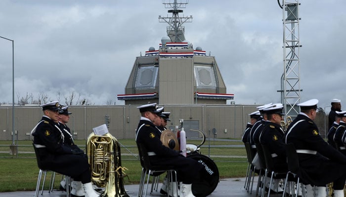 A band sits near the deck house of the American ballistic missile defence base to be integrated into the Aegis Ashore missile defense system, on the day of its inauguration in Redzikowo, Poland on November 13, 2024. — Reuters