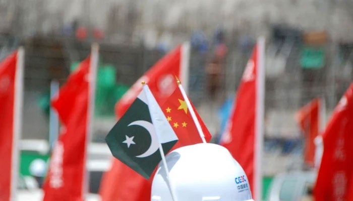 Pakistan and China flags can be seen in this image. — Xinhua/File