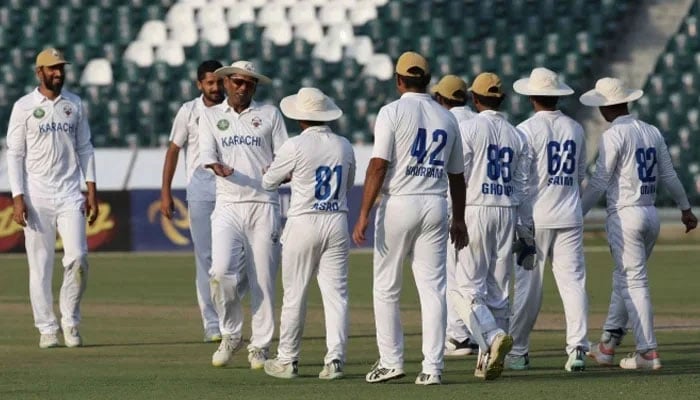 The representational image shows the Karachi Whites during the final of the Quaid-e-Azam Trophy 2023-24. — PCB/File