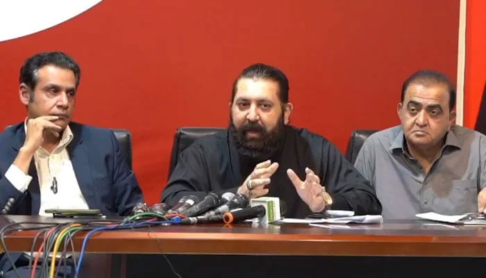 PTI senior leader Sheikh Waqas Akram (centre) speaks during a press conference on May 6, 2024. — Facebook/Pakistan Tehreek-e-Insaf