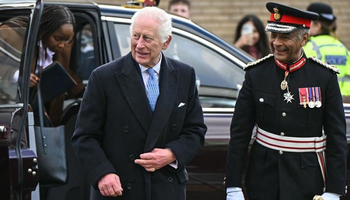 Britains King Charles III (left) arrives to inaugurate the Coronation Food Project hub, located at the Deptford Trading Estate, in southeastern London, on November 14, 2024, to celebrate his 76th birthday and the first anniversary of the Coronation Food Project. — AFP