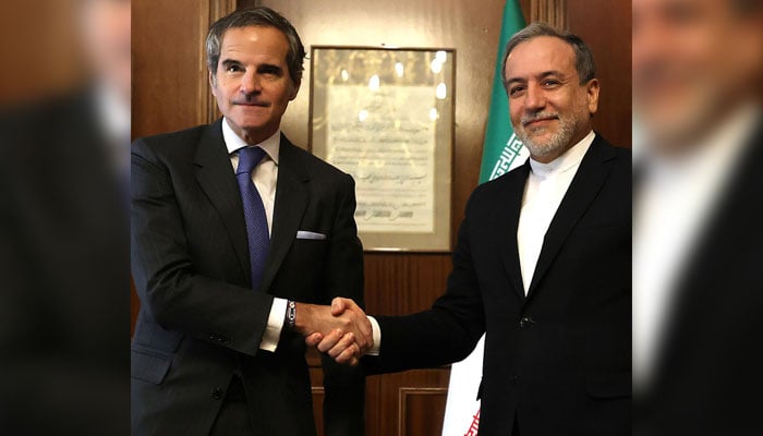 IAEA chief Rafael Grossi (left) shakes hands with Iranian Foreign Minister Abbas Araghchi before their meeting in Tehran on November 14, 2024. — AFP