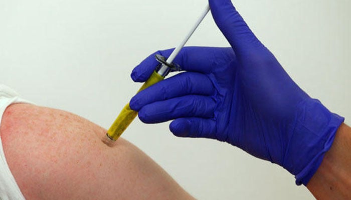 A medical practitioner vaccinating a person. — Reuters/File