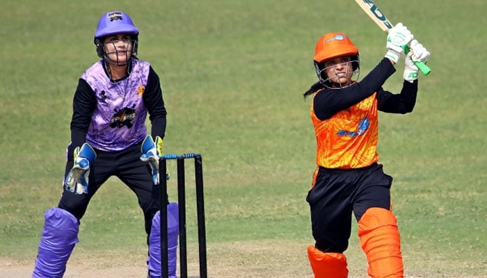 A batter playing a shot in the match between Conquerors and Challengers in the National Women’s One-Day Tournament.— PCB/file