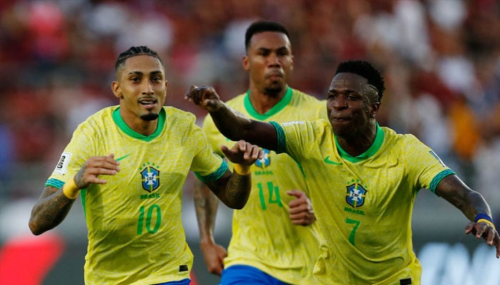 Brazils Raphinha (right) celebrates scoring their first goal with Brazils Vinicius Junior and Brazils Gabriel Magalhaes on November 14, 2024.— Reuters