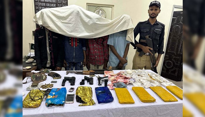 Police officials are showing arrested alleged criminals and recovered seized weapons and drugs to media persons during press conference at Keamari District Police Station in Karachi on November 15, 2024. — PPI