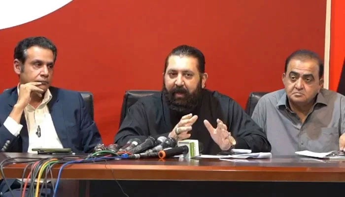 PTI senior leader Sheikh Waqas Akram (centre) speaks during a press conference on May 6, 2024. — Facebook@PakistanTehreek-e-Insaf