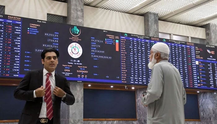 Stock brokers watch share prices during a trading session at the Pakistan Stock Exchange (PSX) in Karachi. — Online/file