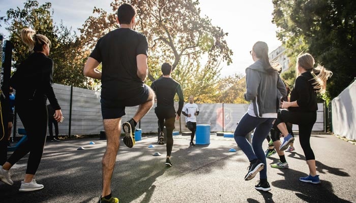 A representational image shows people taking part in a workout. — Unsplash