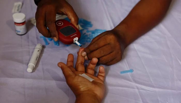 A person receives a free blood sugar test during a campaign to mark the World Diabetes Day in Dhaka, Bangladesh, November 14, 2024. — Reuters