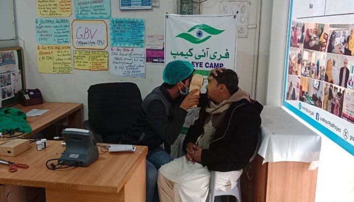 A healthcare expert can be seen checking a patient during a free medical camp on January 26, 2024. — Facebook@JahangirKhanTareen