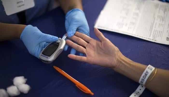 A person receives a test for diabetes during Care Harbor LA free medical clinic in Los Angeles, California September 11, 2014. — Reuters