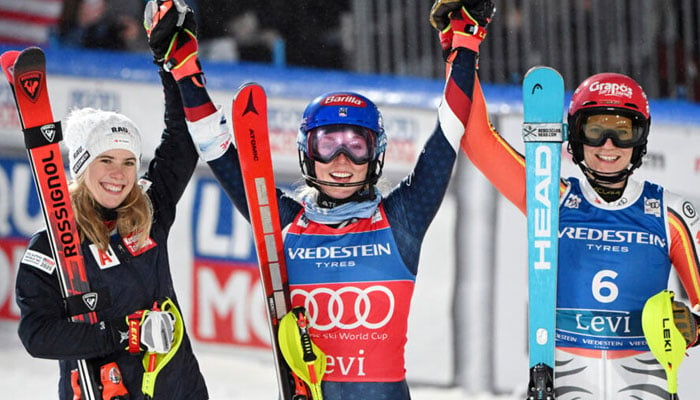 Mikaela Shiffrin (centre) celebrating after winning eighth time. — AFP/File