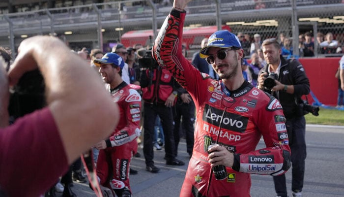 Francesco Bagnaia posing for the photo after winning the MotoGP sprint race in Barcelona. — AFP/File