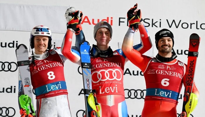 (Left to right) Second placed Norway’s Henrik Kristoffersen, winner France’s Clement Noel and third placed Switzerland’s Loic Meillard celebrate on the podium after the men’s slalom event during the FIS Alpine Skiing World Cup in Levi, Finland on November 17, 2024. — AFP