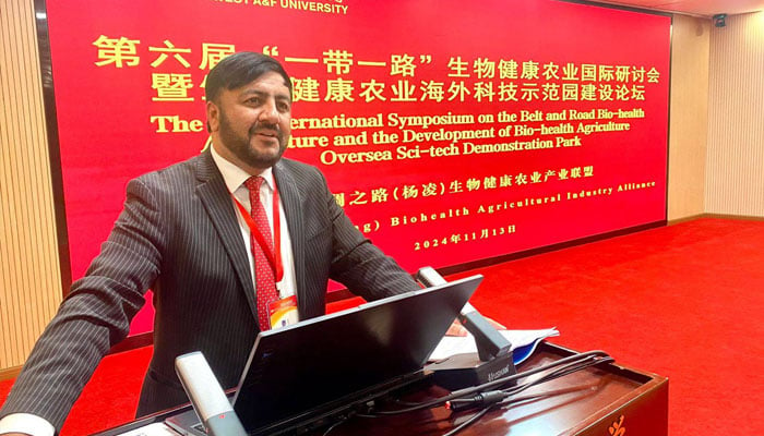 A speaker addressing the 6th International Symposium on the Belt and Road Bio-health Agriculture and China-SCO National Bio-Health Agriculture Overseas Science and Technology Demonstration Park Construction Forumin China.— Facebook@ORICqauisb/file