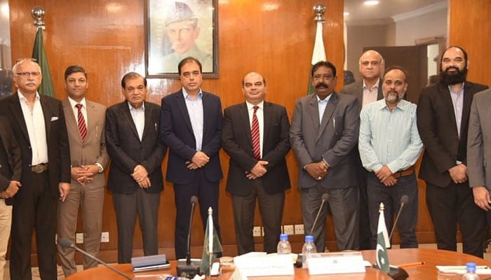 Registrar NUTECH Brigadier Adnan Qasim (centre) along with others pose for a photo at FPCCI on November 17, 2024. — Facebook@NUTECHPAK