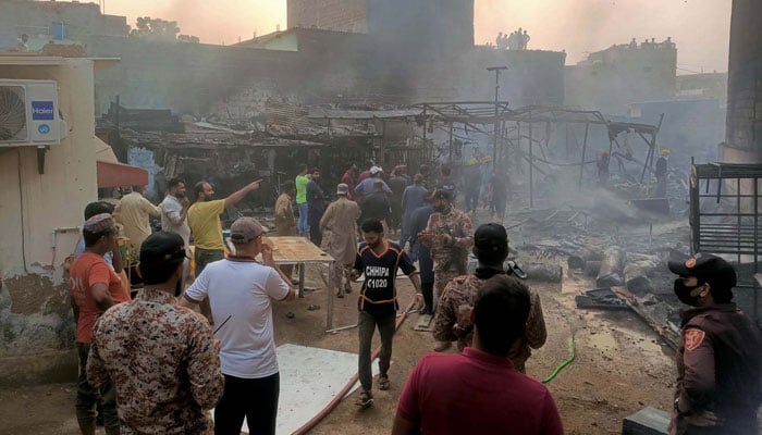 Fire brigade officials extinguish fire at Lasi Para, Malir in Karachi on November 17, 2024. — PPI