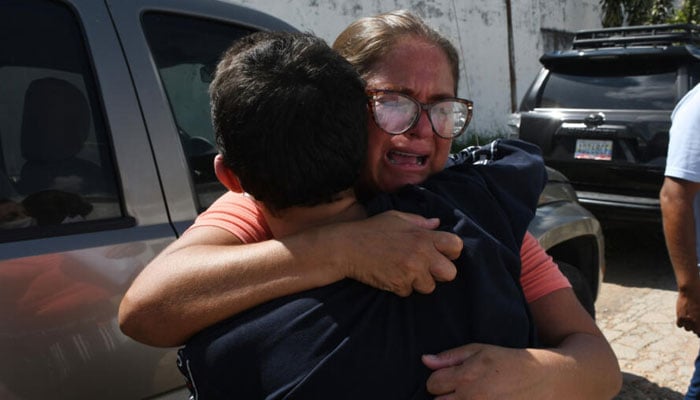 A young man arrested during protests after the disputed July 28 presidential election hugs a relative after his release outside the Tocuyito prison in Tocuyito, Carabobo State, Venezuela on November 16, 2024. — AFP