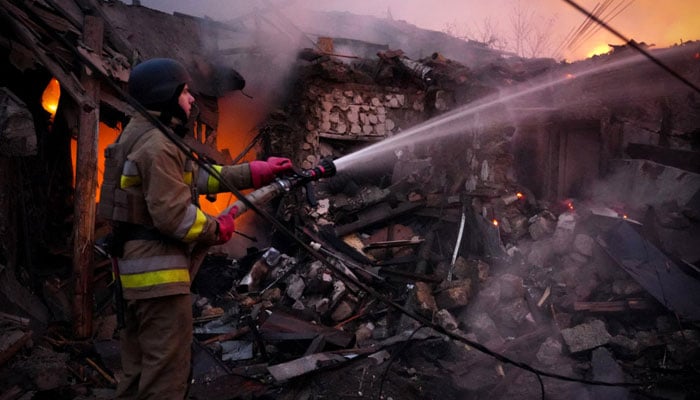 A Ukrainian rescuer works to extinguish a fire in a building following a drone attack in Mykolaiv on November 17, 2024. — AFP/File