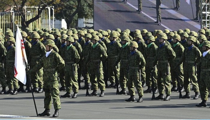 Members of the Japan Self Defense Forces (JSDF) stand in formation at Ground Self-Defence Force Camp Asaka on November 9, 2024. — AFP