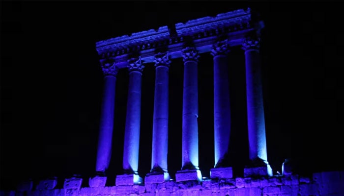 Part of the temples of Baalbek, a UNESCO world heritage site in Lebanons eastern Bekaa Valley, illuminated in blue light, Oct. 24, 2015. — AFP