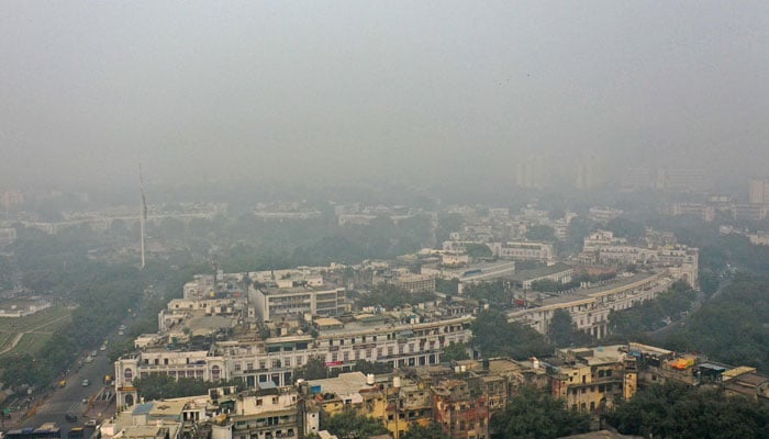 An aerial view shows the skyline engulfed in heavy smog in New Delhi on November 17, 2024. — AFP