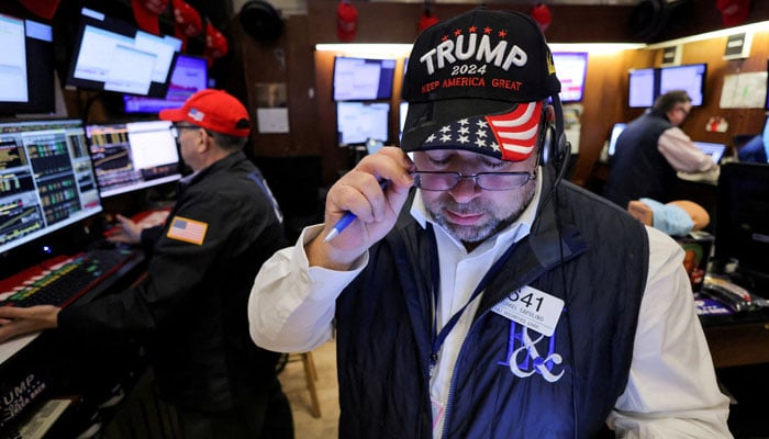 A trader wears a hat in support of Republican Donald Trump, after he won the US presidential election, at the New York Stock Exchange (NYSE) in New York City, US on November 6, 2024. — Reuters