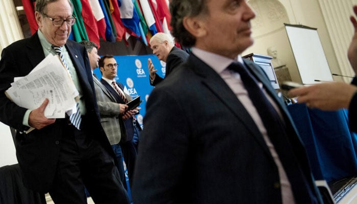 Canadian former justice minister and rights activist Irwin Cotler (left) carrying files can be seen. — AFP/file