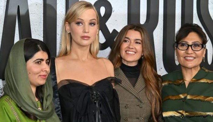 (From left) Nobel Peace Prize winner Malala Yousafzai and US actress Jennifer Lawrence teamed up with producer Justine Ciarrocchi and director Sahra Mani to make Bread & Roses, a documentary about the plight of women in Taliban-run Afghanistan. — AFP/file