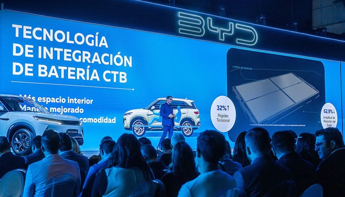 A presenter presenting about a BYD cars features. — Facebook@bydcompany/file