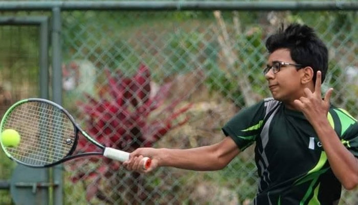 Tennis player Abubakar Talha playing a shot. — Facebook@AbTalhachamp/file