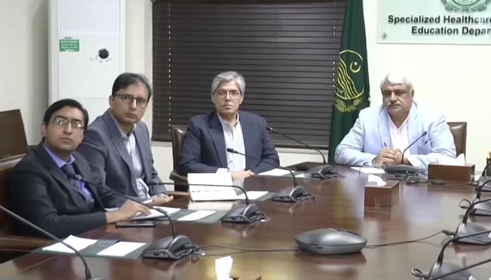 Punjab Health Minister Khawaja Salman Rafique (right) presides over a meeting regarding the health card in the Specialised Healthcare and Medical Education Department on November 19, 2024. — Screengrab via Facebook@SalmanRafiquePK