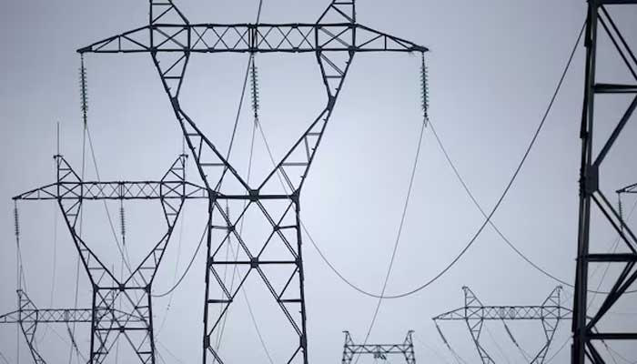 Electrical power pylons of high-tension electricity power lines seen on November 14, 2023. — Reuters