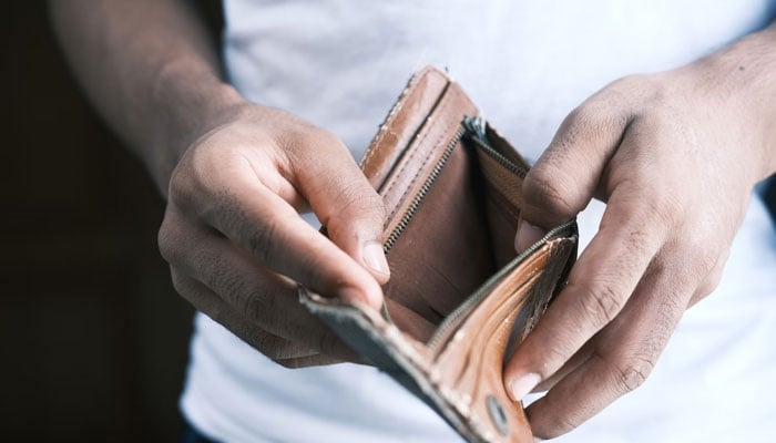 Representational image of a person showing his empty wallet. — Unsplash/file